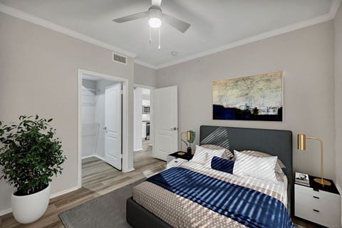a bedroom with a large bed and a ceiling fan at River Stone Ranch, Texas