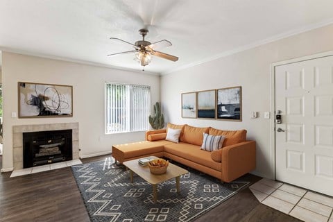 a living room with a couch and a ceiling fan at Altezza High Desert, Albuquerque, New Mexico