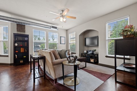 a living room with a couch and a tv