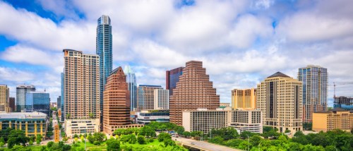 Downtown Austin skyline with high-rise buildings, highlighting areas where luxury apartments can be rented for less.