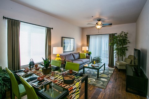 a living room and dining room with a couch and a table