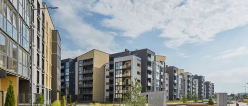 New modern apartment building in a green area.