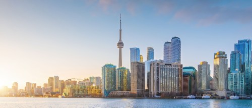 Toronto skyline at sunrise, featuring the iconic CN Tower and modern high-rises, highlighting the city’s status as a major renter hub in Canada.