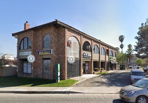A street view of a building with a sign that reads "Bakery".